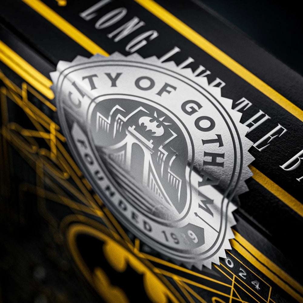 Super close up of the seal on a deck of batman playing cards.
