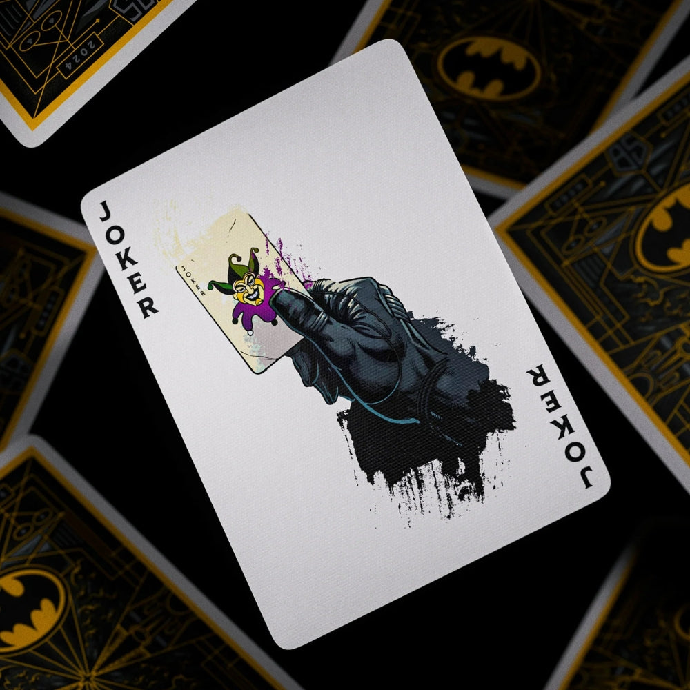 Joker card, taken from a set of batman playing cards. This card shows batman holding a joker card in his hand
