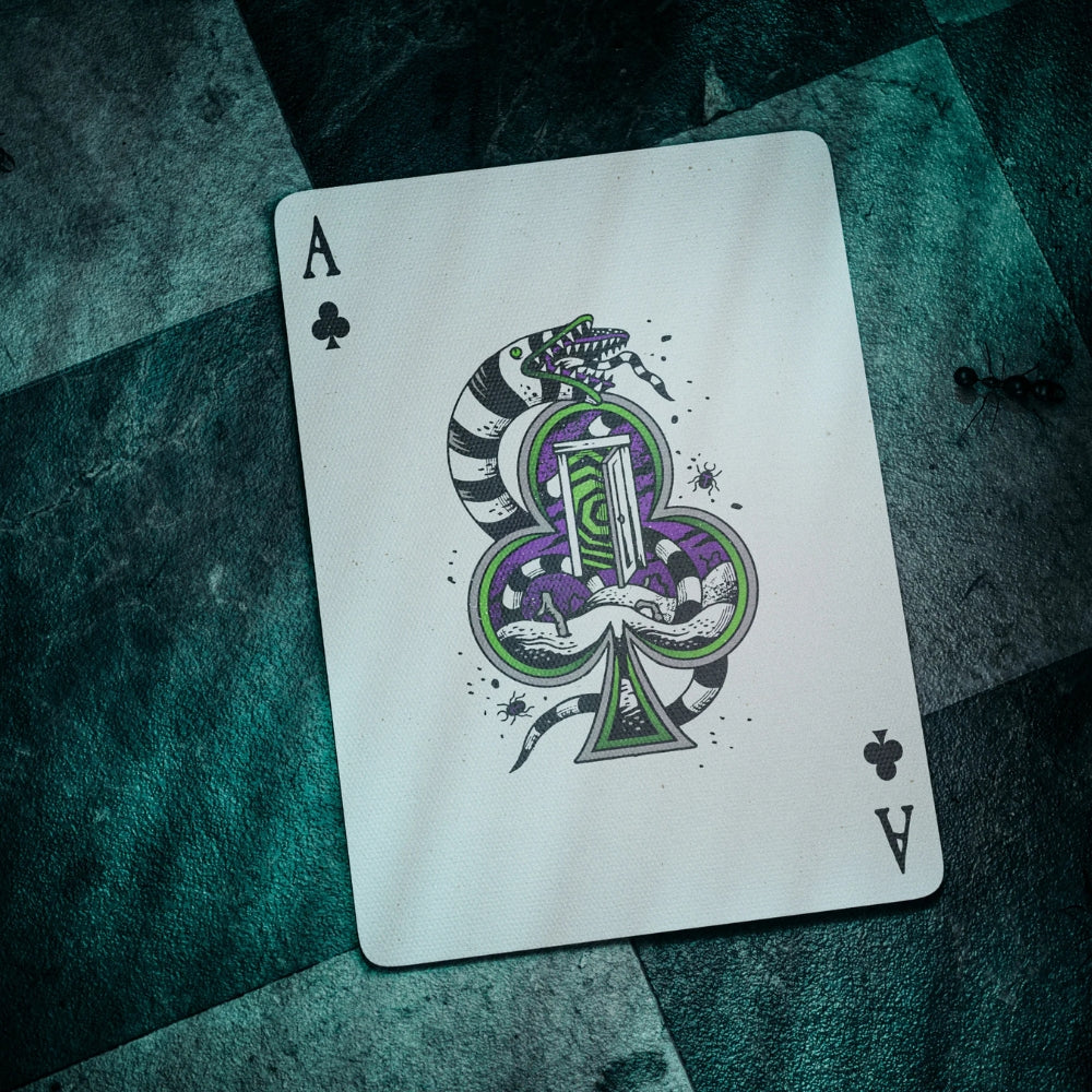 Ace of clubs card, taken from a deck of Beetlejuice playing cards, featuring a sandworm
