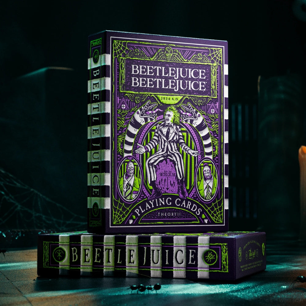 Deck of beetlejuice cards standing on top of another deck box, with a dark creepy background