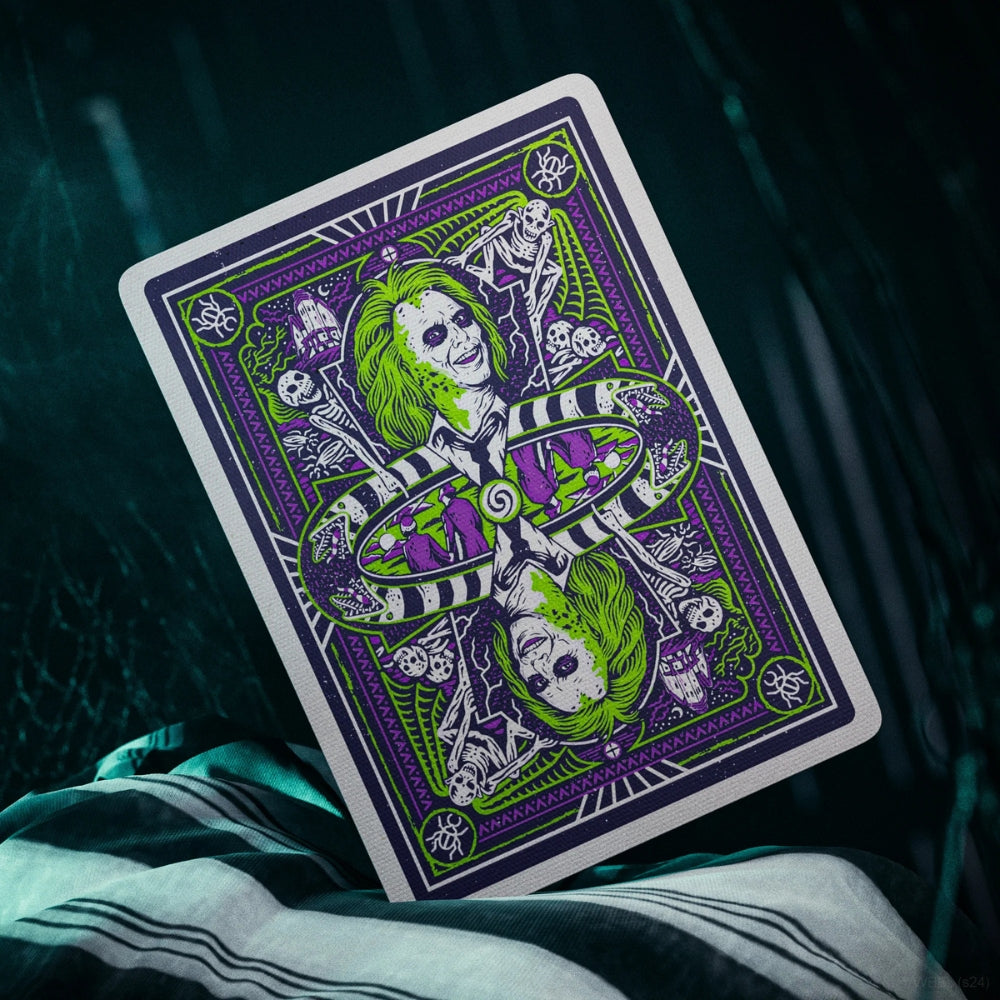 Back of a Beetlejuice playing card, standing on black and white cloth