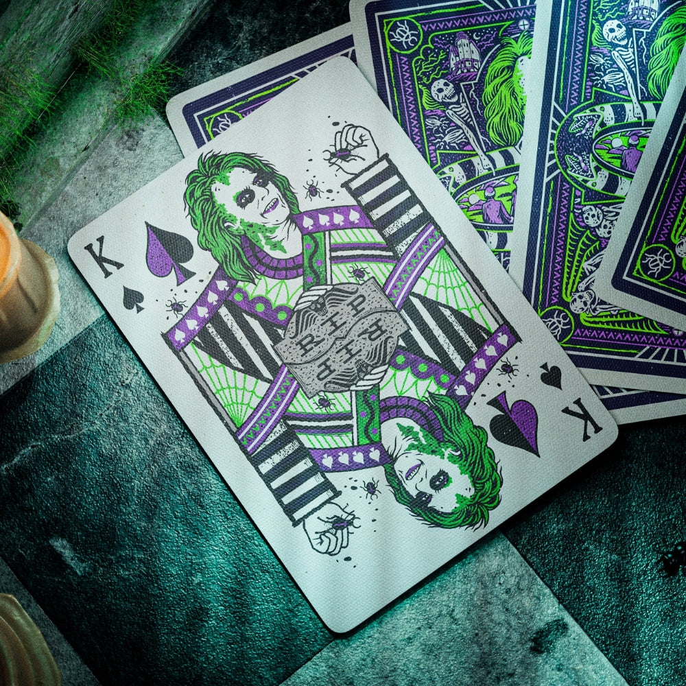 King of spades card taken from a deck of Beetlejuice playing cards. set on a green hued chequered floor