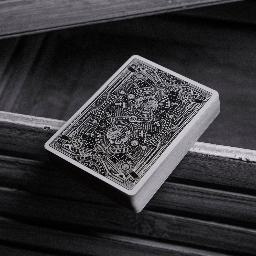 Deck of contraband playing cards stack facedown on a wooden surface