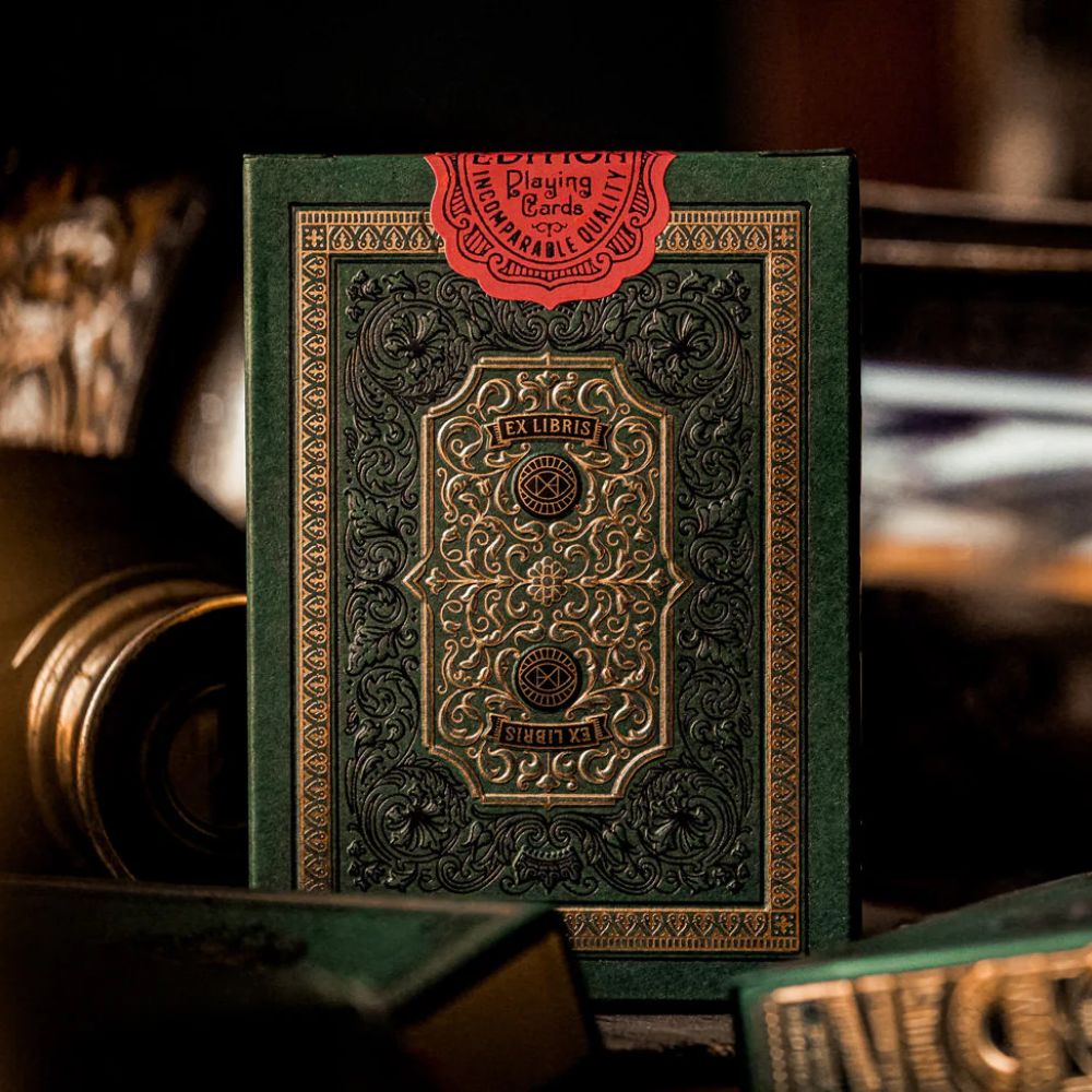 Derren Brown Playing Cards, single deck box standing on a desk around other deck boxes