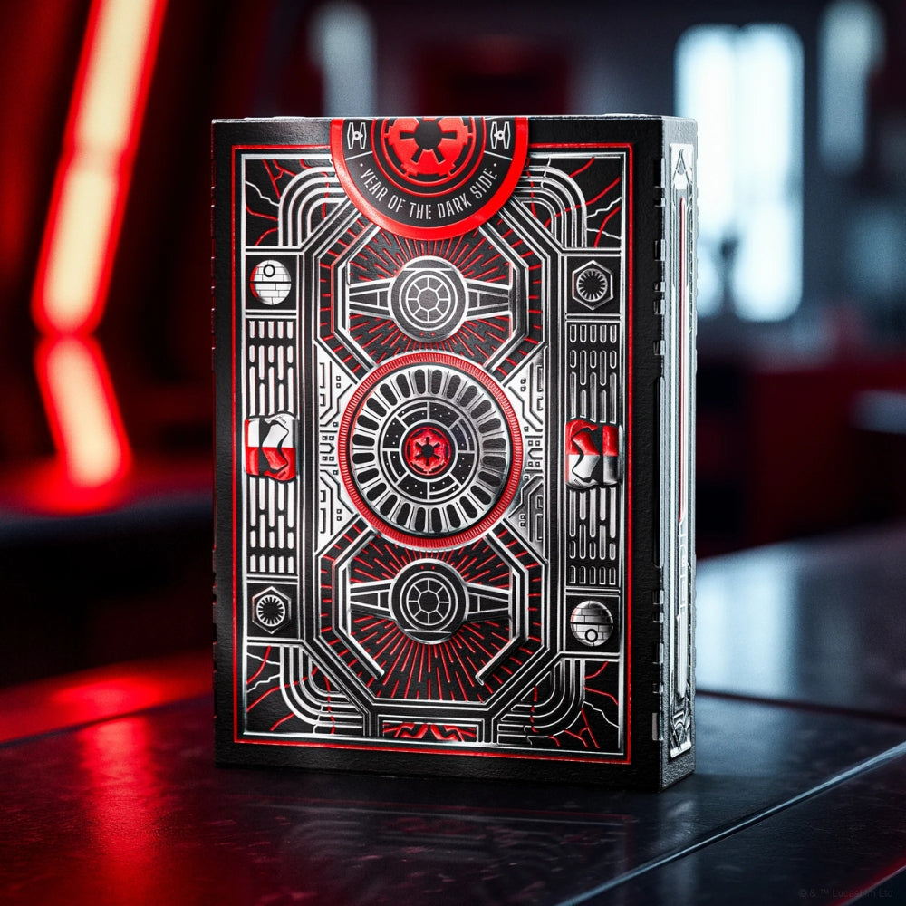 A deck box of Star Wars playing cards standing upright in a room with a metallic, sci-fi space ambiance
