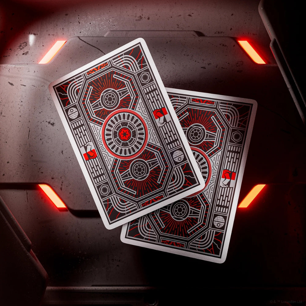 two face down star wars playing cards floating over a sci-fi themed door or wall panel