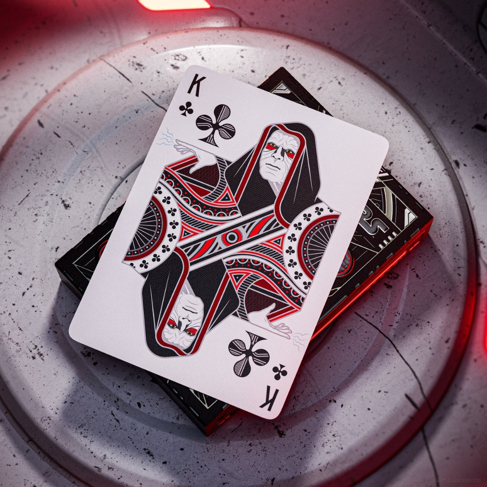 King of clubs card laying on a deck box from a set of star wars playing cards