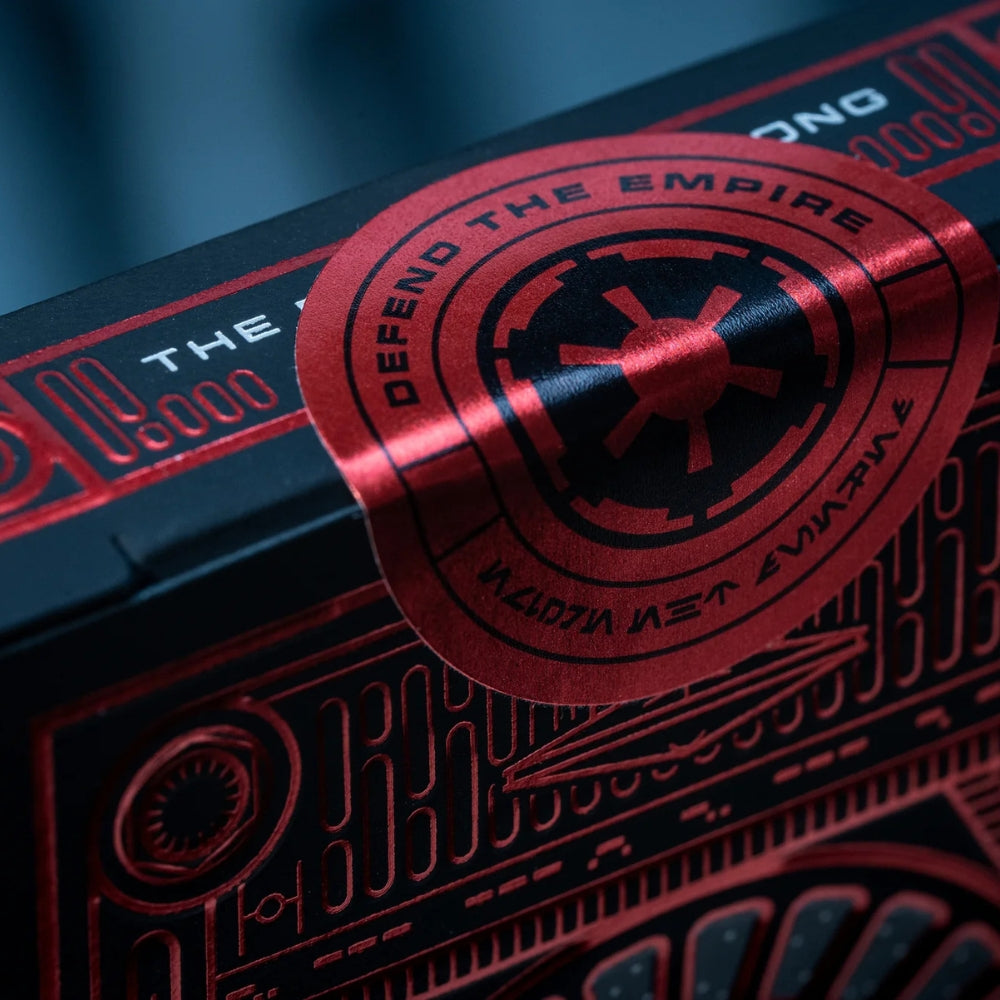 super close up of the seal on a deck of star wars playing cards, the seal is shiny black and red
