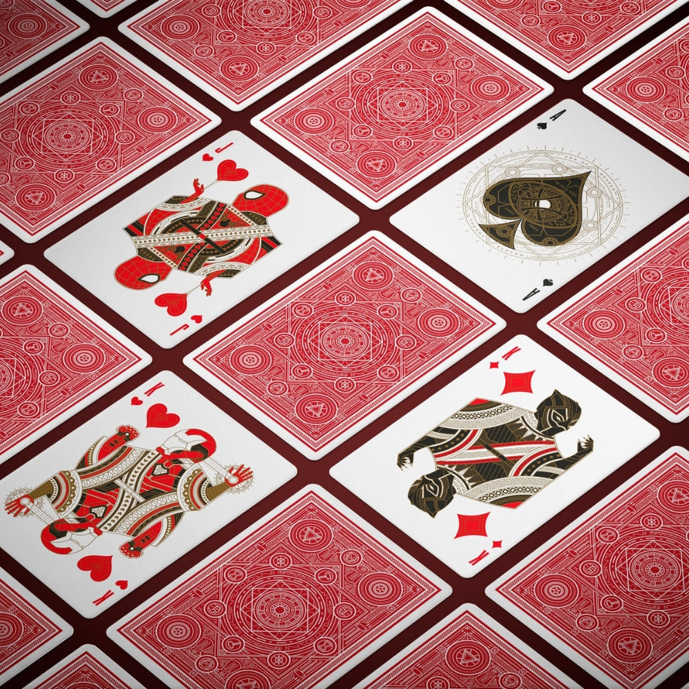 a selection of avengers playing cards, with some cards laying facedown, some face up, including king and jack of hearts.