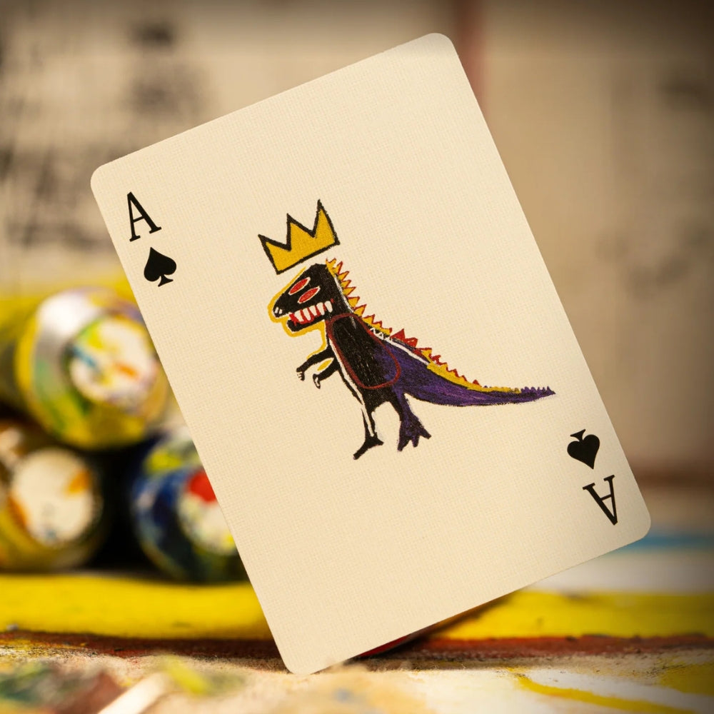 Ace of spades playing cards, featuring a painted dinosaur from artist basquiat