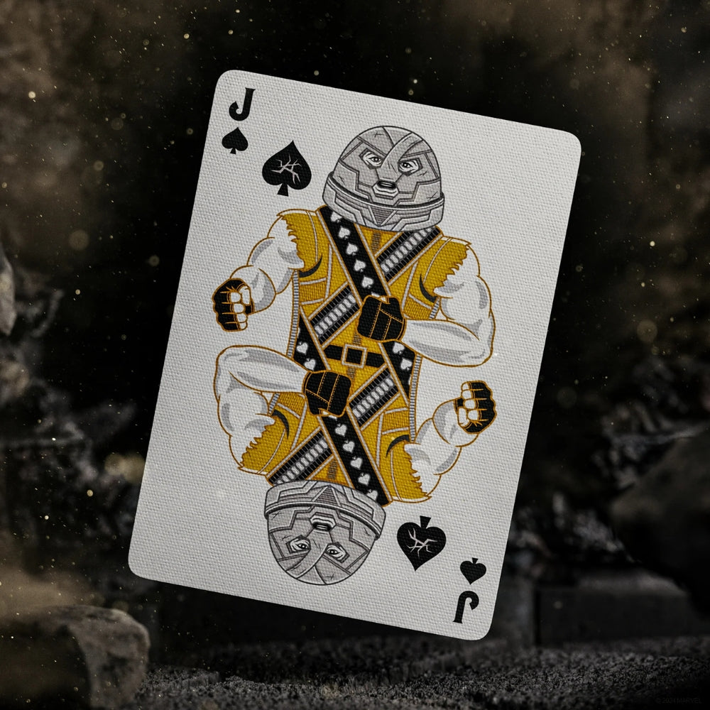 Jack of spades from a set of deadpool playing cards, floating within a dusty and rocking surface