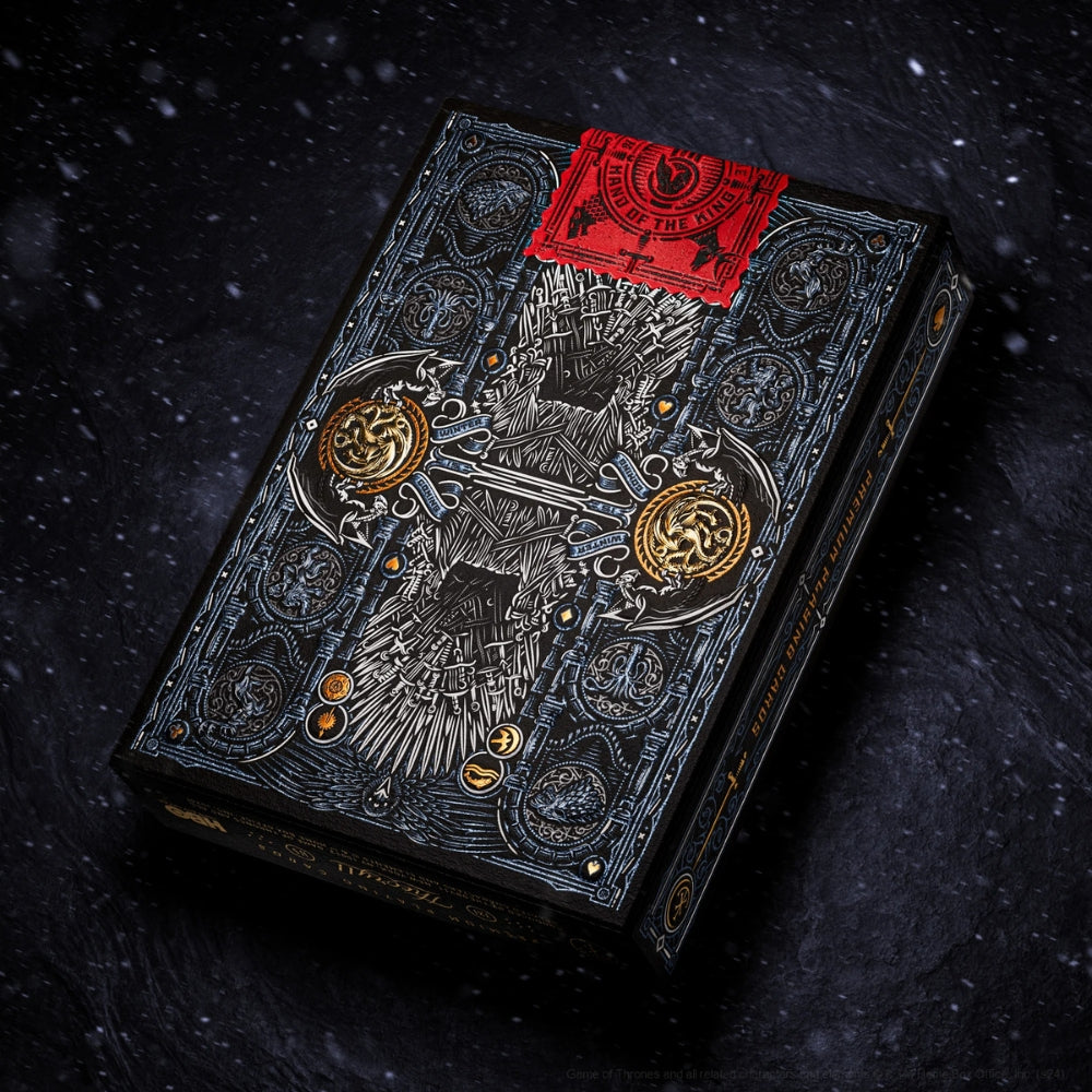 Back of a deck box of game of thrones card, laying on a black rocky surface
