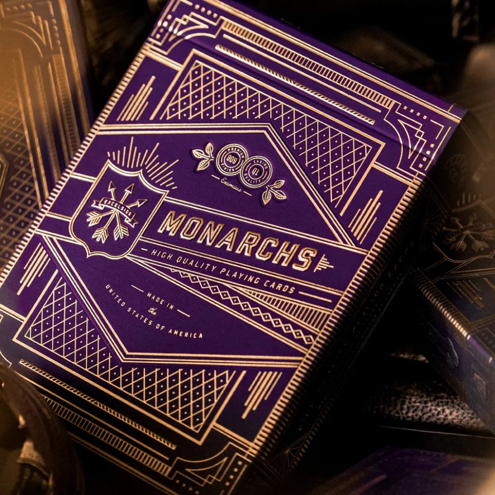 Purple monarch playing cards - stack of man deck boxes, close up of top deck