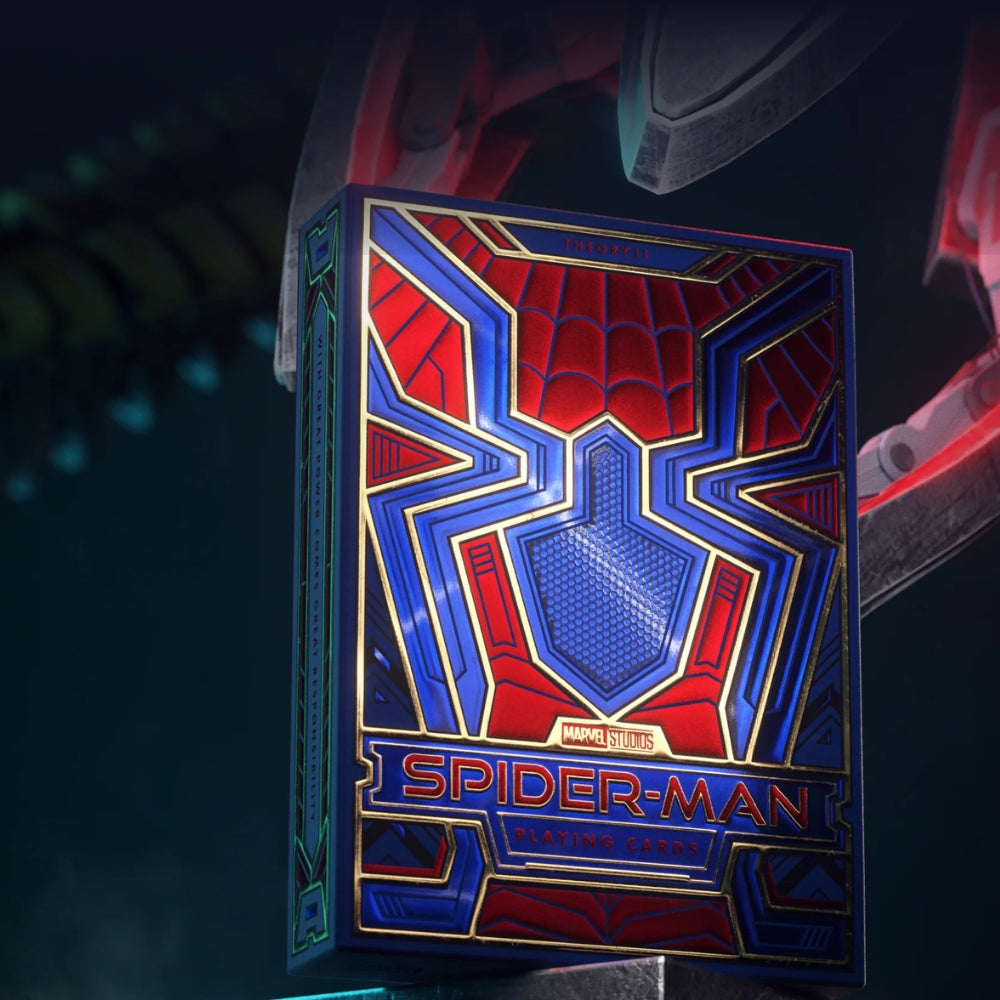 picture of a claw reaching down to grab a box of Spiderman playing cards