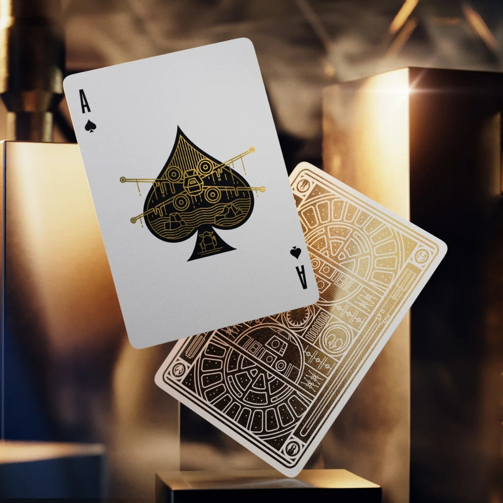 Ace of spades and a face down card floating with a select of metallic cuboids in the background. The cards are from a star wars playing cards deck, and the ace of spades features an xwing