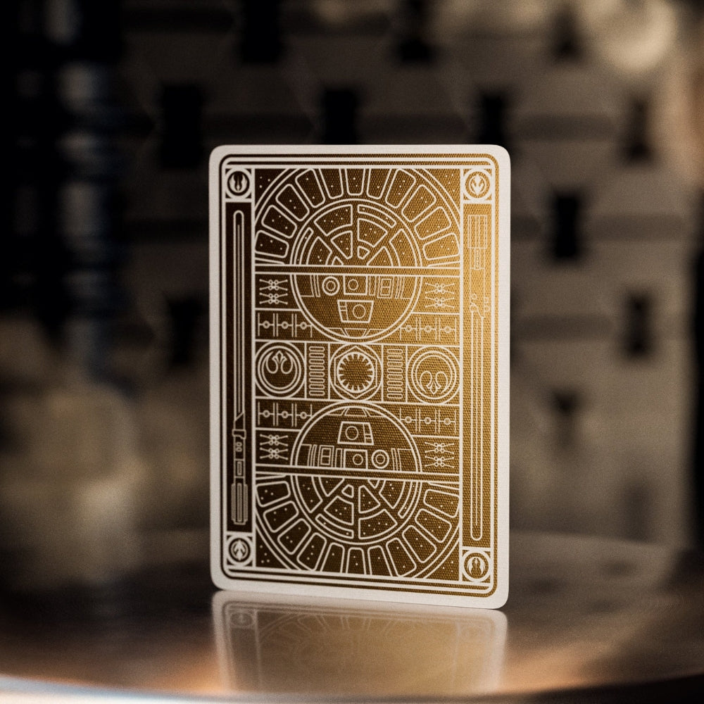 Back of a star wars playing card, detailed in white and gold