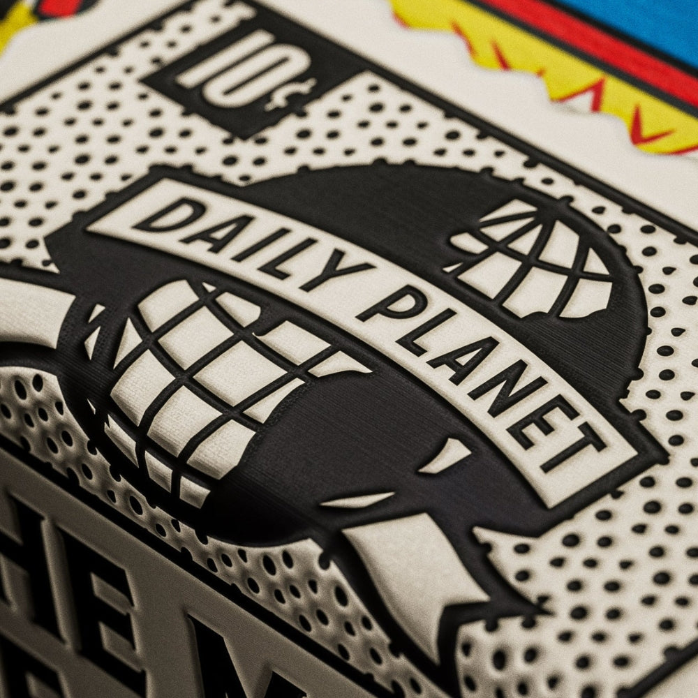 Super close up of the seal on a deck of superman playing cards, feating the daily planet logo and a 10 cents price tag