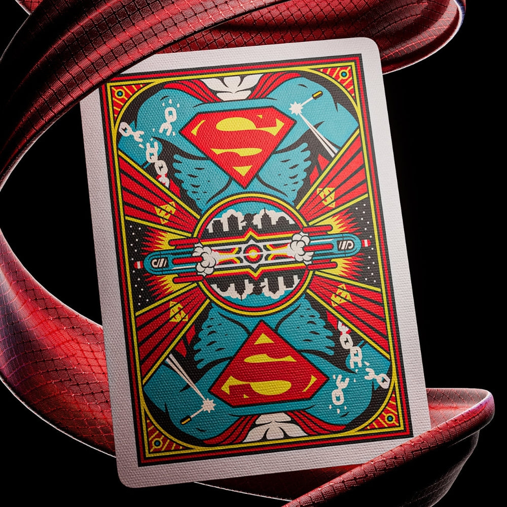 Back of a superman playing card, with a swirl of red cape like fabric