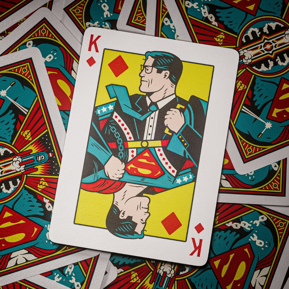 Superman playing cards, showing a king of diamonds laying on top of a selection of facedown cards