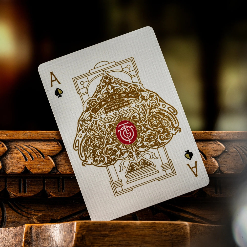 Ace of spades taken from a set of Tavern on the green (red edition) playing cards. Card is standing on a ornate carved wooden surface