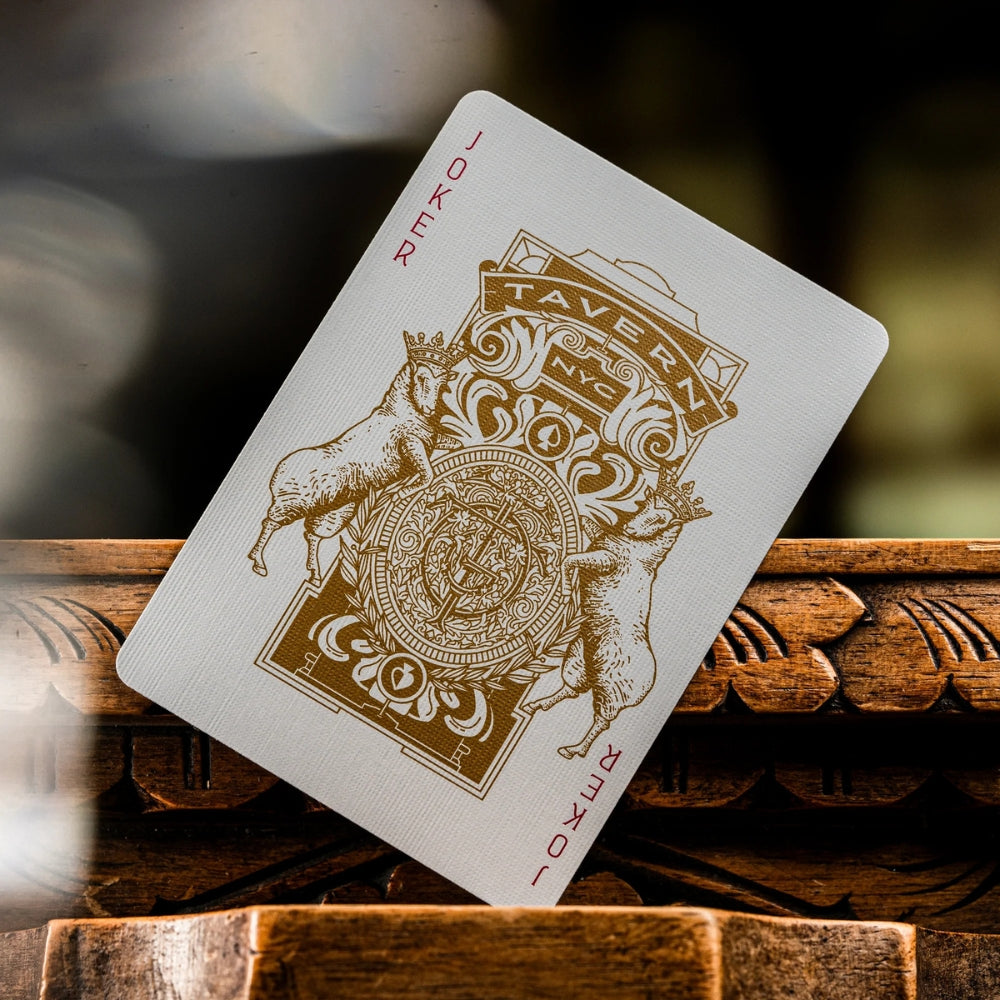 Joker card standing on a wooden surface, taken from a set of tavern on the green playing cards