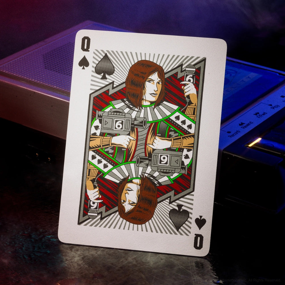 Queen of spades from a deck of teenage mutant ninja turtles playing cards, leaning against a retro tape recorder
