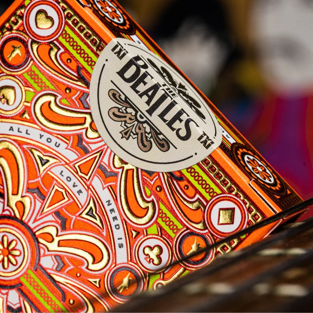 close up photo of the seal on a pack of orange deck (The Beatles)