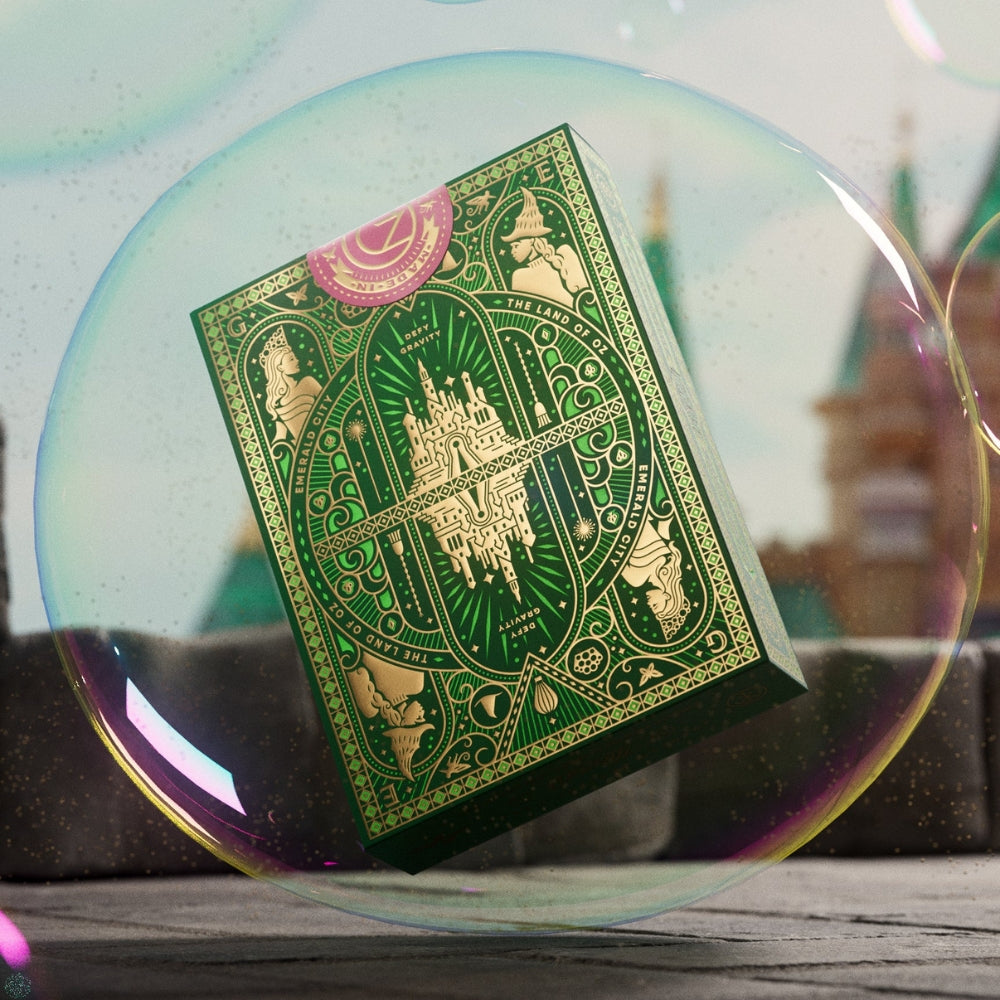 Deck of wicked playing cards suspended in a bubble on a wooded surface