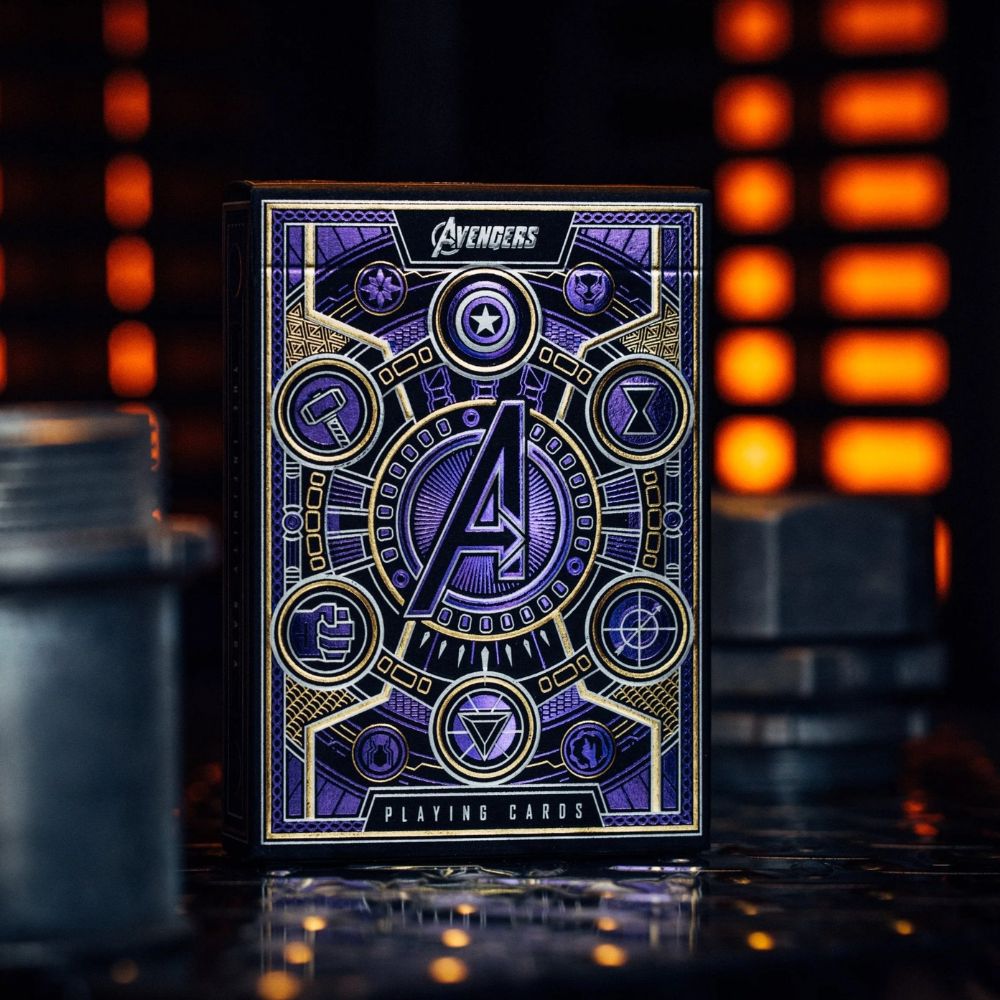 Avengers playing cards - purple - single deck box on metal surface with glowing lights in background