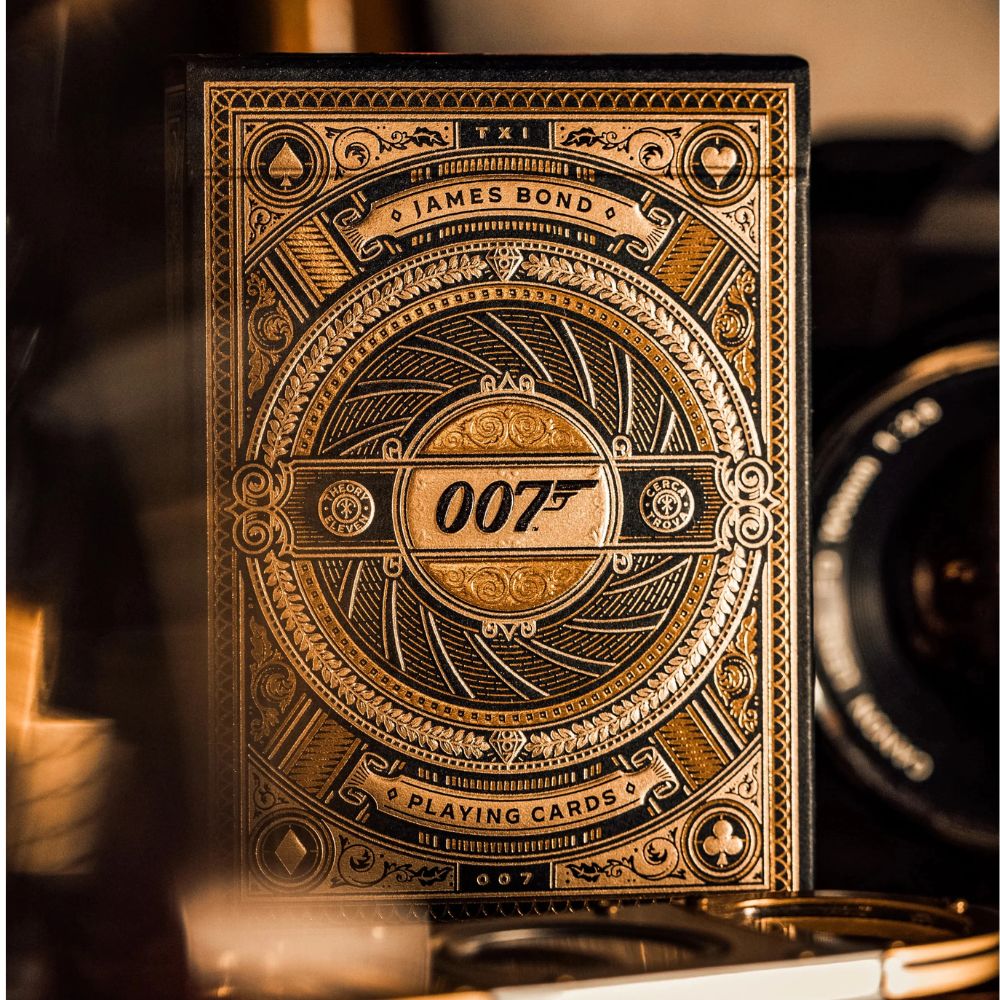 James bond playing cards - Gold - Close up of one deck box with camera in background