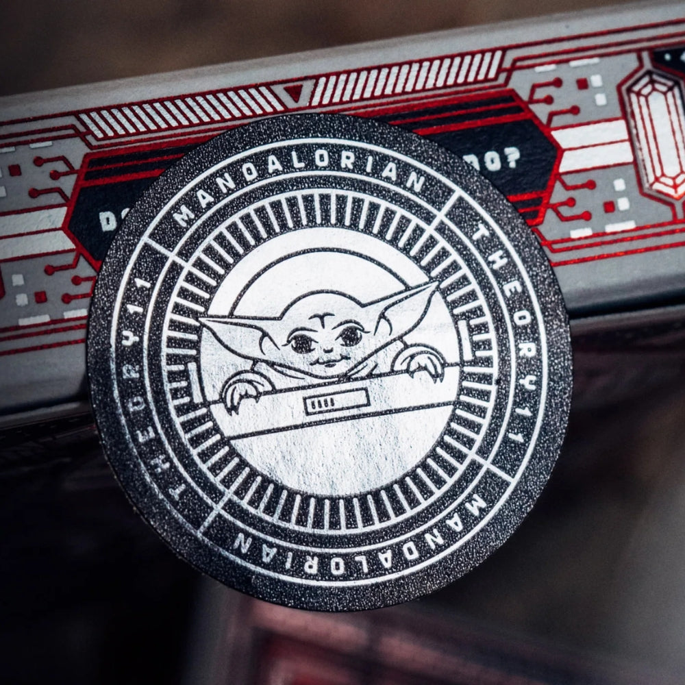 Close up of the shiny seal on a box of Mandalorian playing cards, featuring the Child Grogu