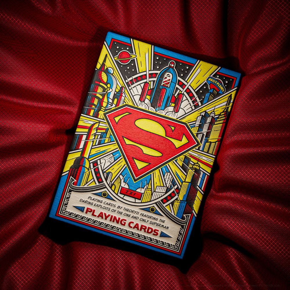 Superman playing cards on a silky red cape