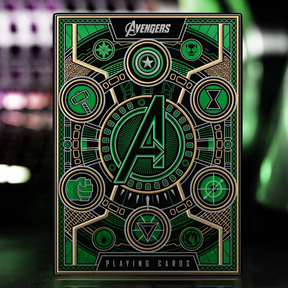 Single deck box of avengers playing cards (green) on an out of focus backdrop