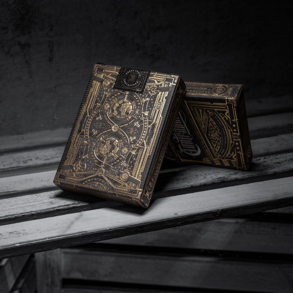 Contraband playing cards - two deck boxes leaning against each other on a wooden slatted surface