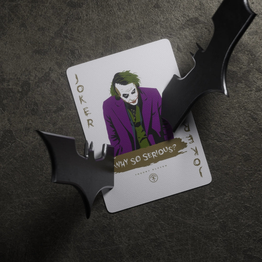 Joker cad (why so serious) with two metal batarangs sticking out of it