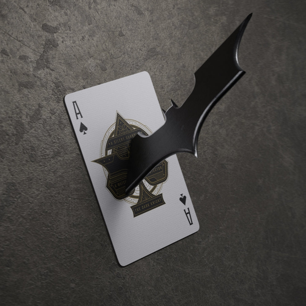 Ace of spades playing card, pined to a wall with a batarang