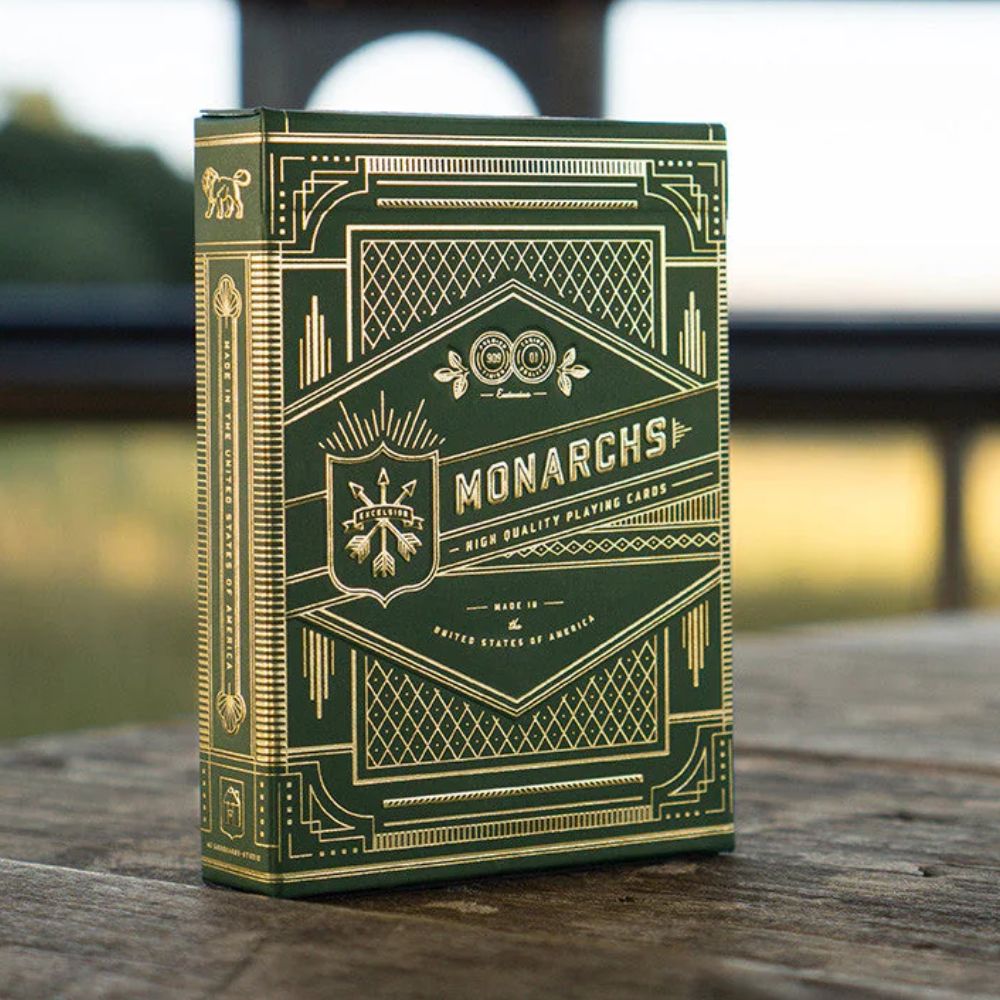 Monarch playing cards - Green edition deck box on a wooden bench outside