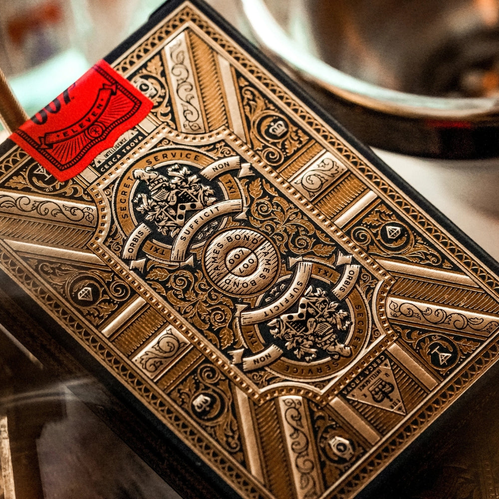 Close up of the back of the Jame bond playing cards deck box, colours are black and gold foiling 