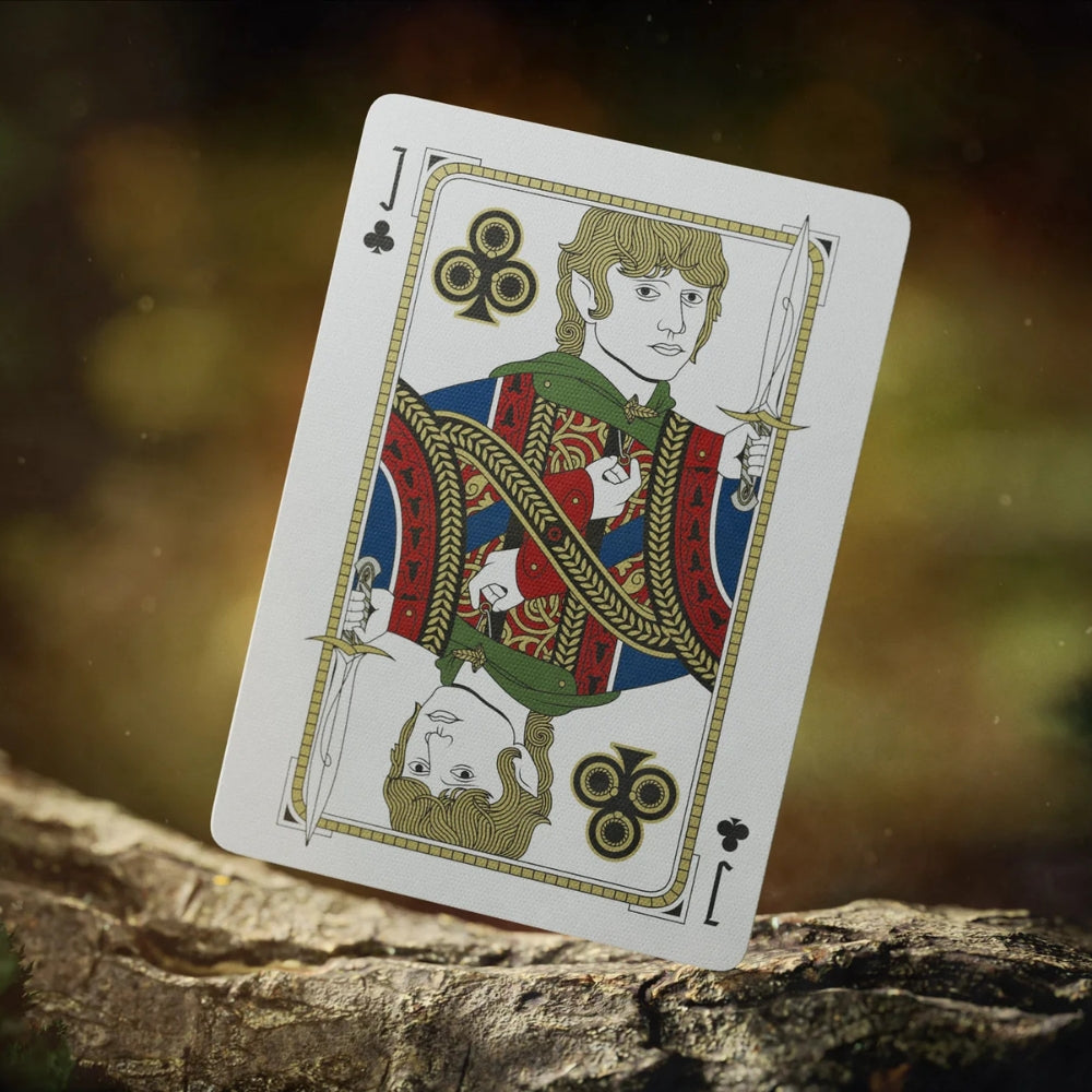 Jack of clubs card, resting on the bark of a treee.  The card is taken from a deck of Lord of the rings playing cards.