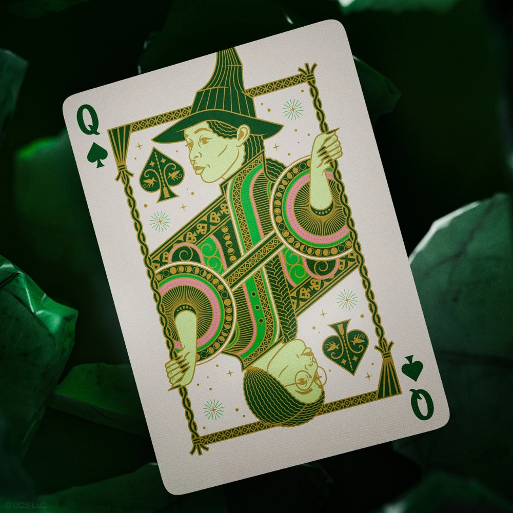 Queen of spades taken from a deck of wicked playing cards, with an emerald hued background